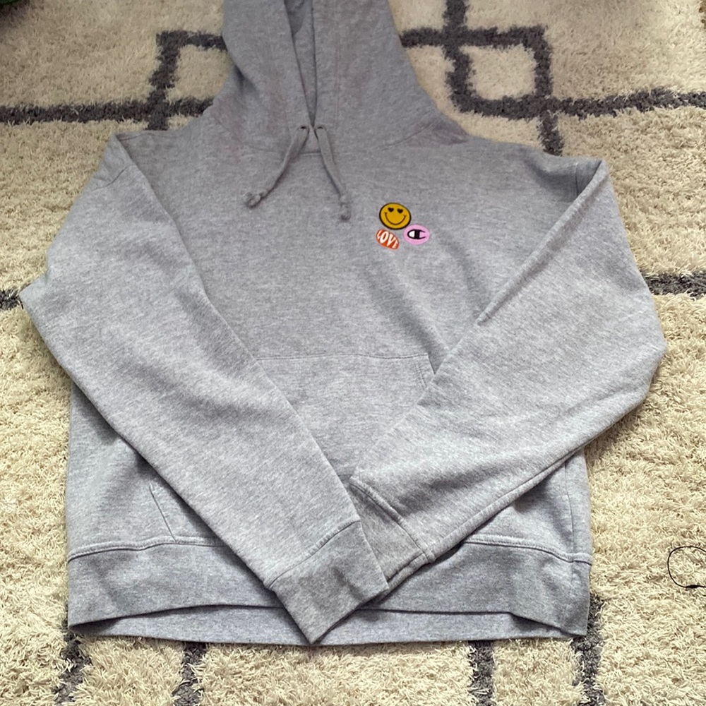 Gray small champion hoodie with patches on shoulder